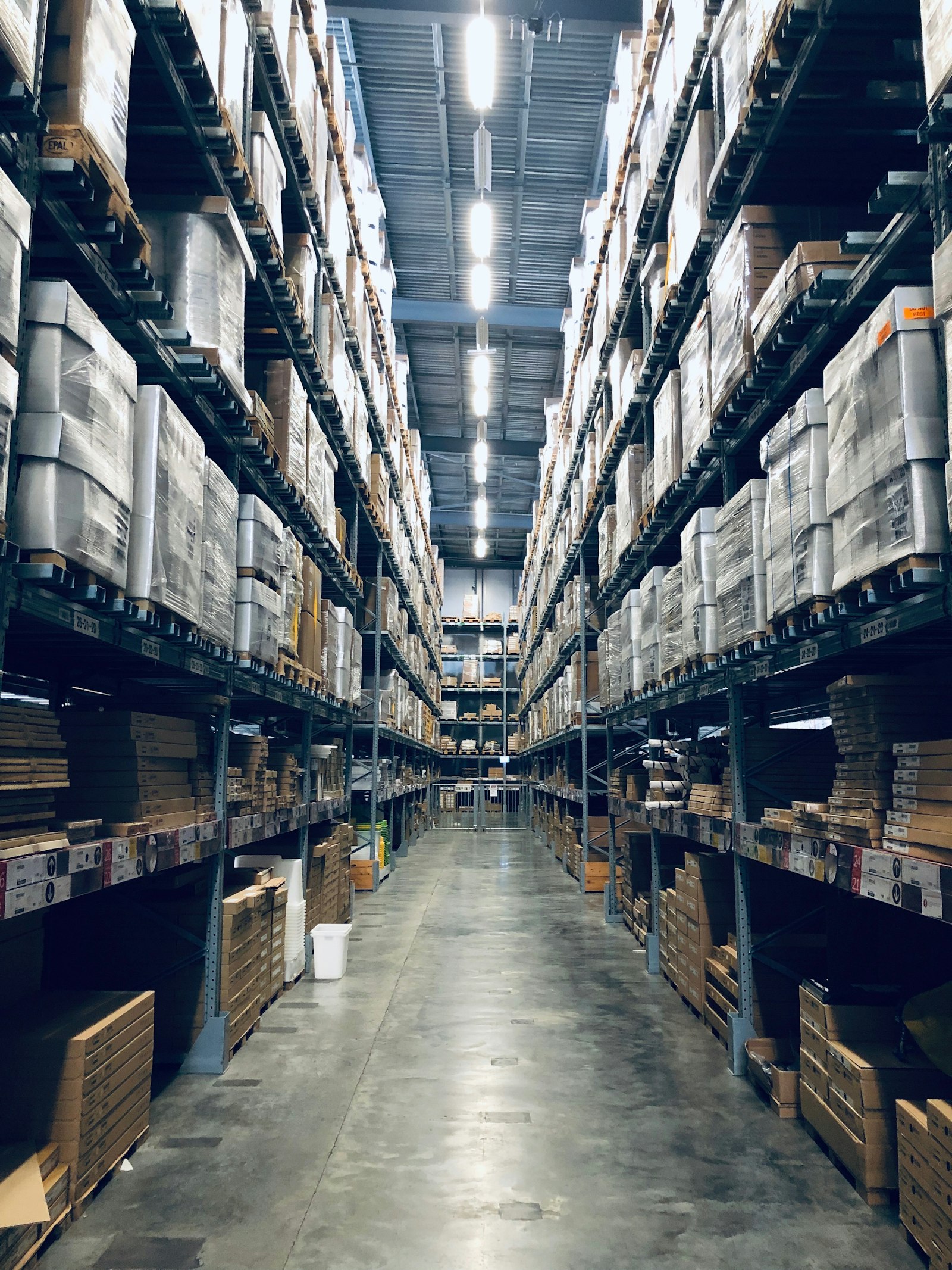 Organised warehouse aisle with stored goods